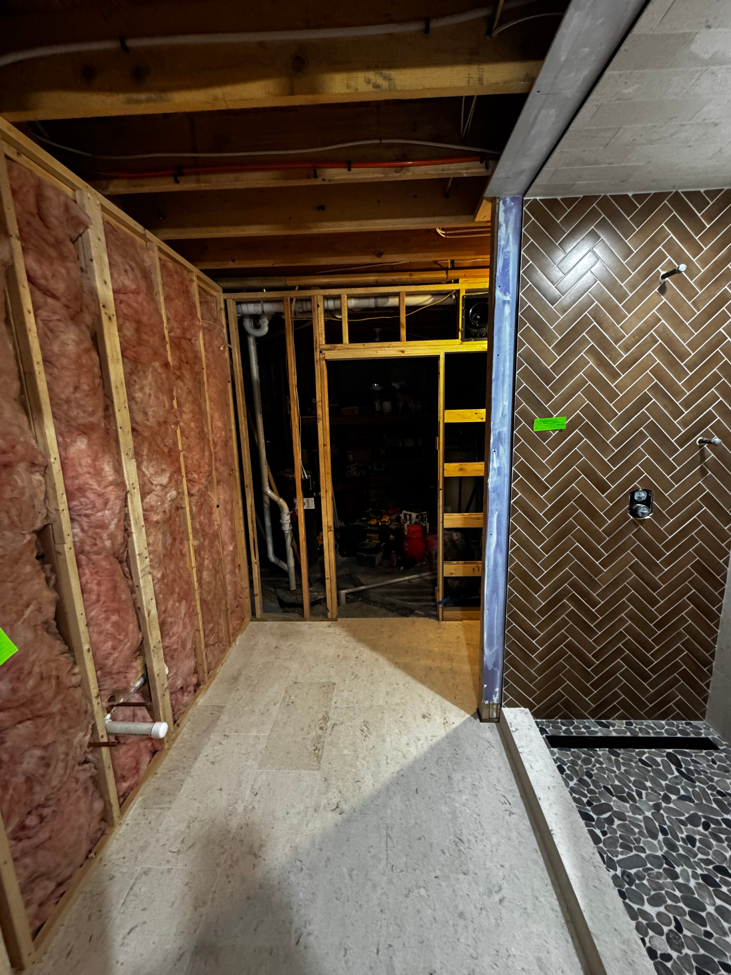Bathroom remodel in progress showing framing and tile work