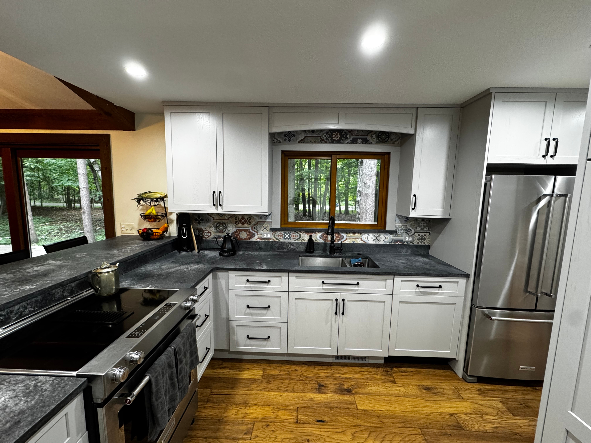 Custom white shaker kitchen with soapstone counters