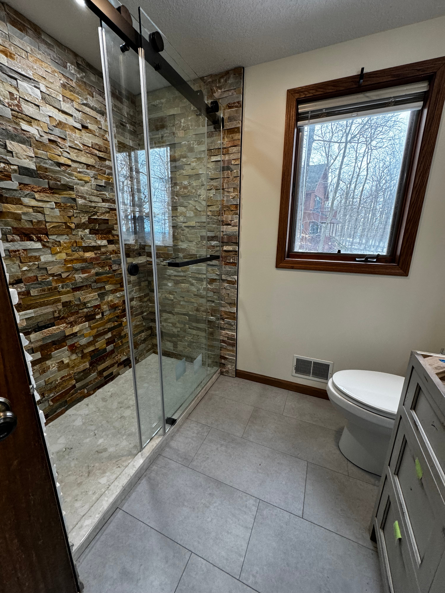 Stacked stone walk-in shower